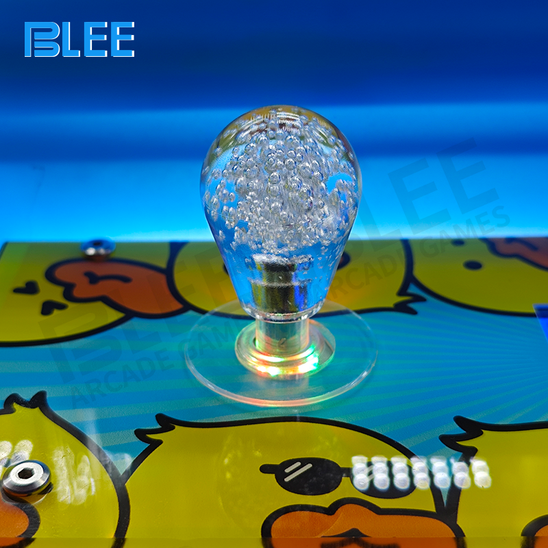 Desktop claw machine with joystick and coin slot