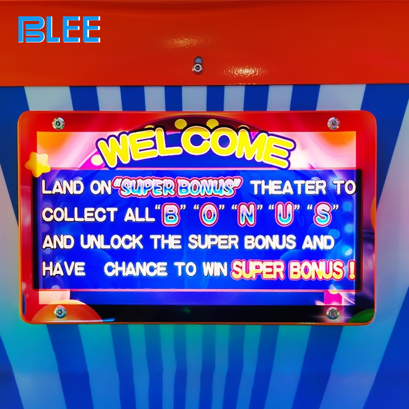 amusement game machine with big spinning wheel and flashing lights