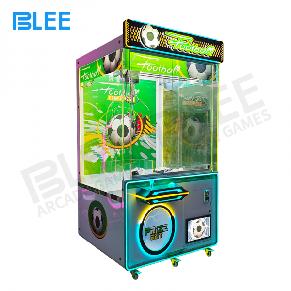 football theme claw machine with LED lights in arcade