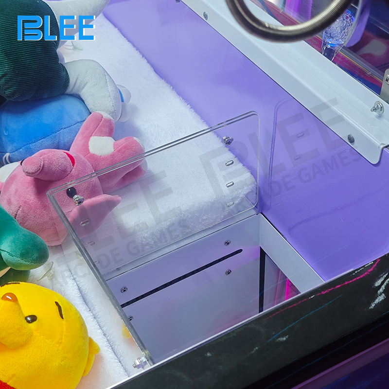 Close-up of kids winning toys from claw game