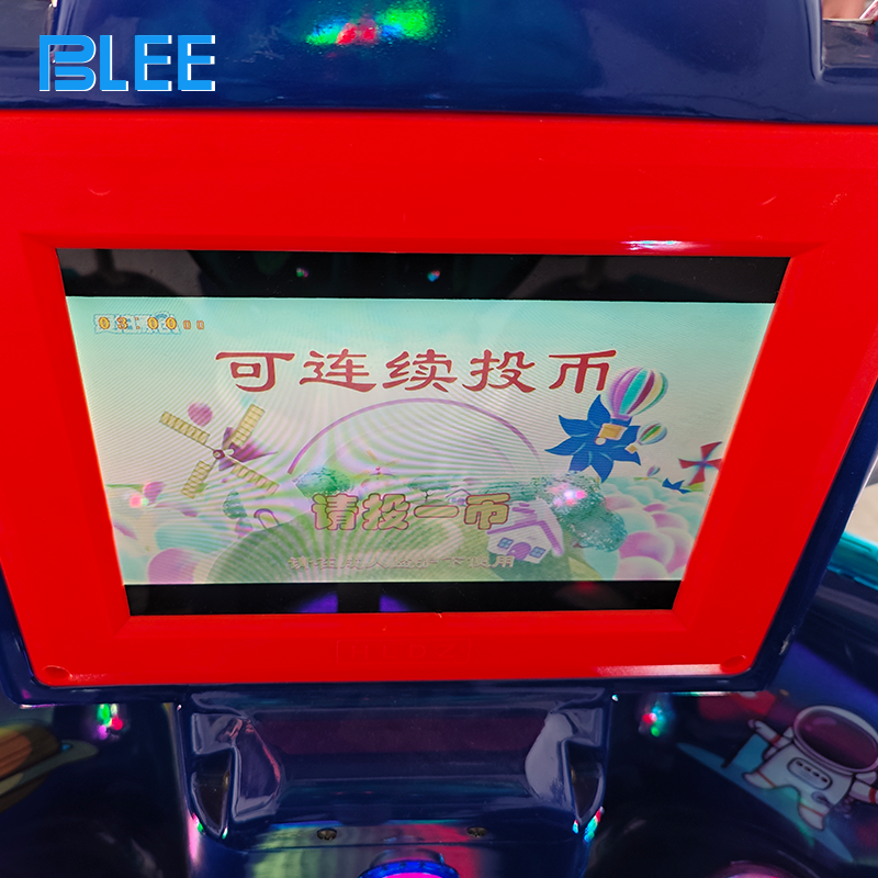 Children riding interstellar-themed amusement ride