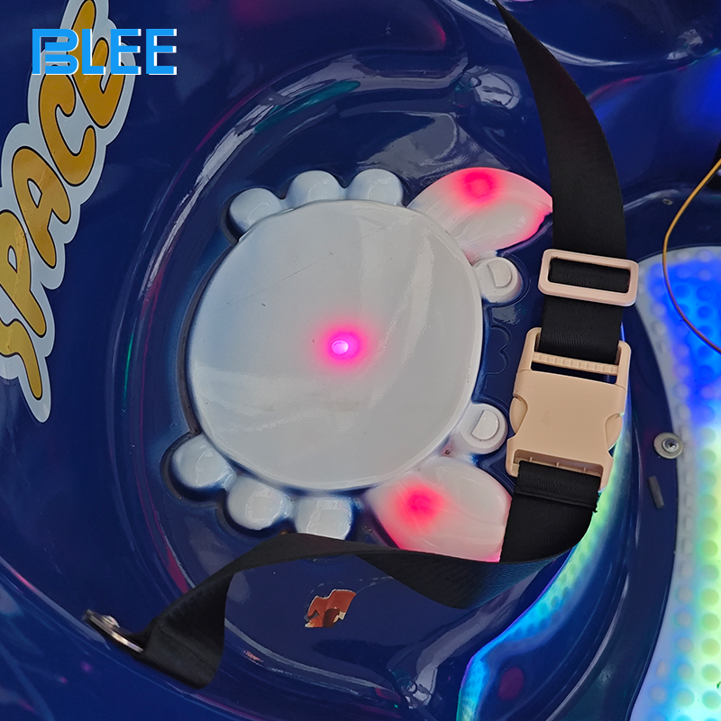 Children riding interstellar-themed amusement ride