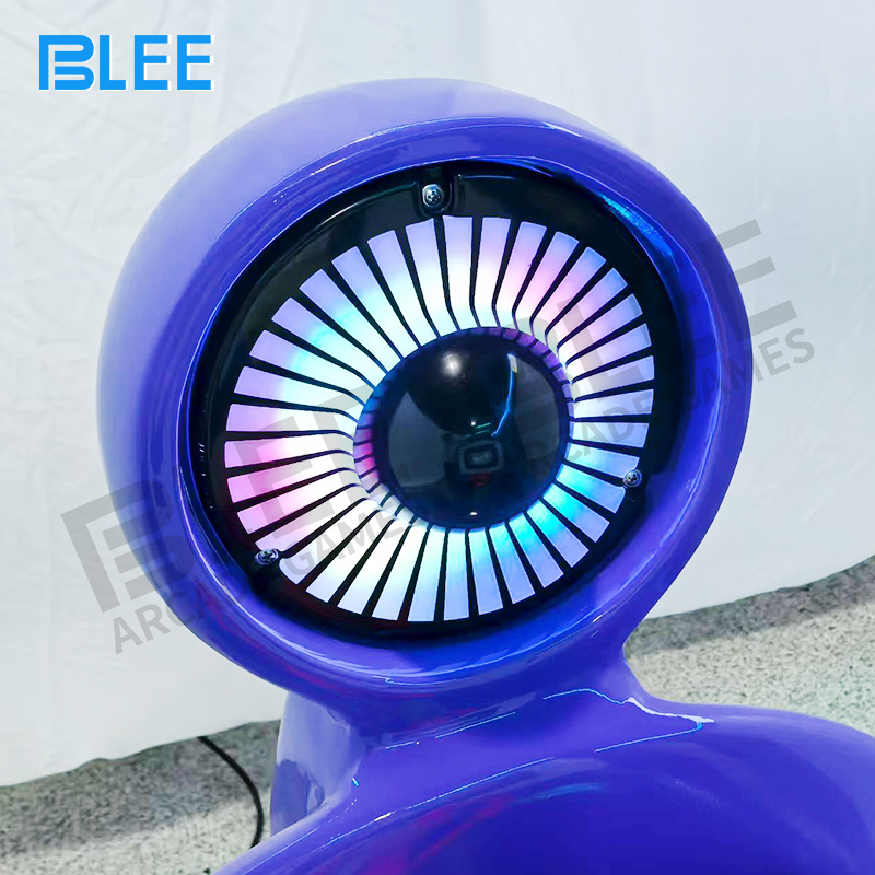 Child enjoying blue BLEE electric swing ride in arcade