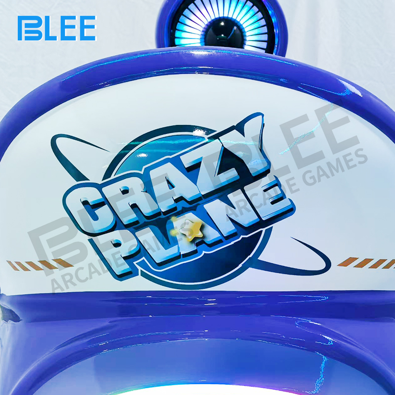 Vibrant LED lights on blue BLEE kids swing ride at night