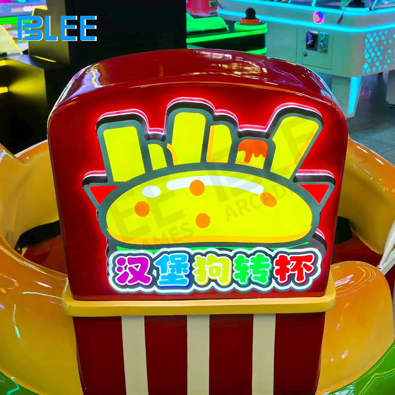 Close-up of hamburger themed cup design on spin ride