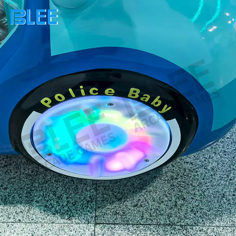 Children enjoying police car themed swing experience