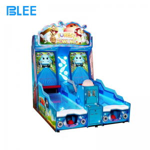 Players competing in multiplayer bowling action on BLEE redemption machine