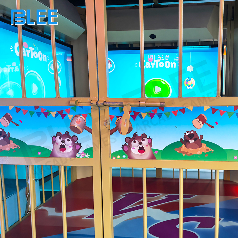 Two players working cooperatively on 75-inch infrared touch screens under time pressure