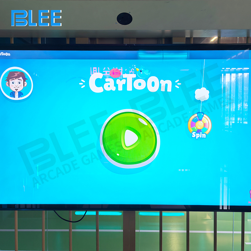 Dual 75-inch touch screen interface displaying various challenge games and countdown timer