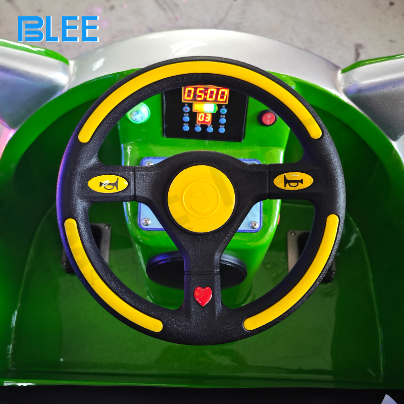 A young driver confidently operating the car in a dedicated play area.