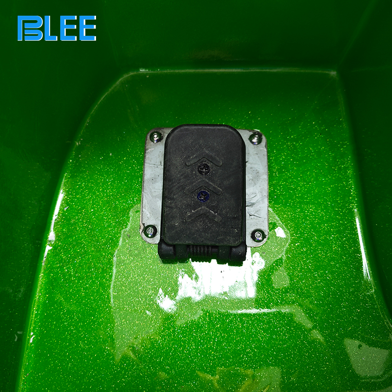 The in-dash entertainment unit with speaker grille and control buttons.