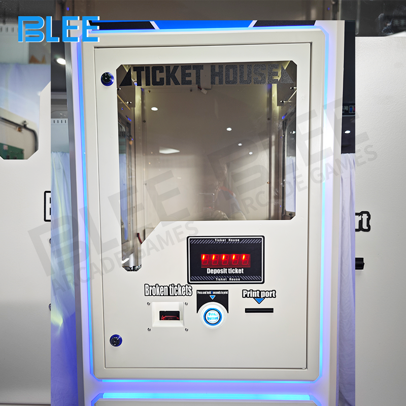 Coin dispensing trays on each side with illuminated output indicators for user convenience.