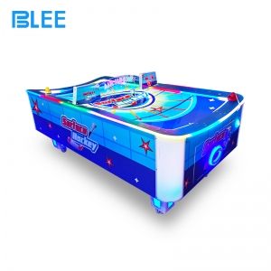 Two competitors engaged in head-to-head battle, striking the puck with professional mallets.