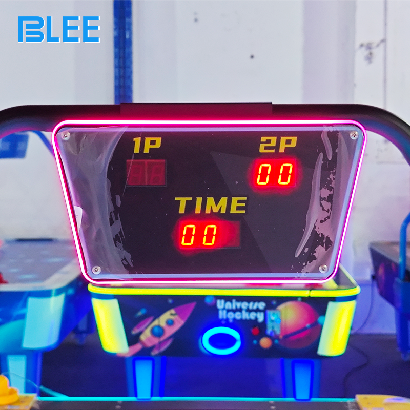 Dynamic action shot capturing a game-winning goal as the puck flashes into the illuminated goal slot.