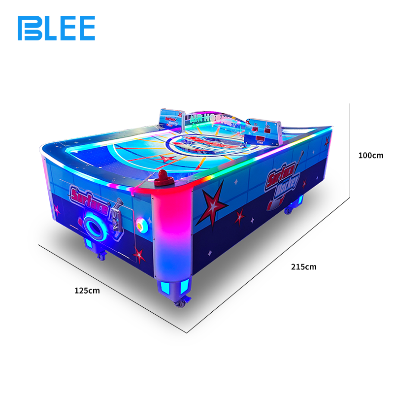 Action shot of a goal scored as the puck disappears into the opponent's goal slot.