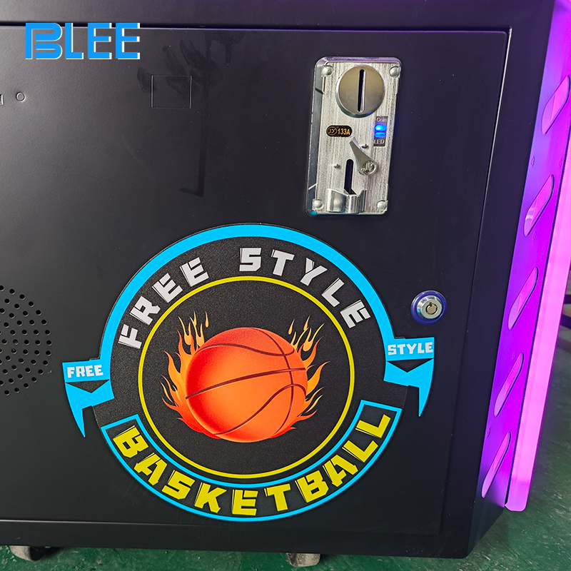 Child easily inserting a coin into the accessible payment slot to begin their interactive basketball adventure.