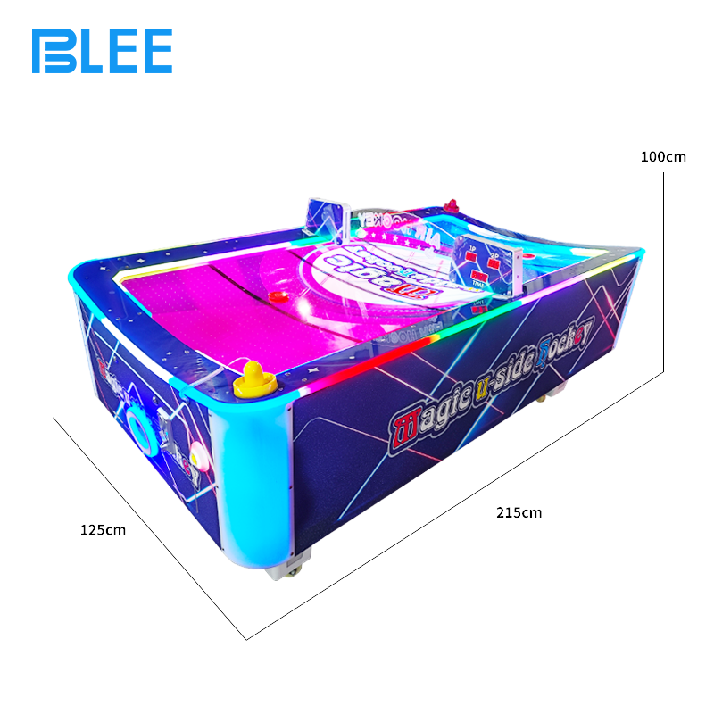 Two competitors engaged in head-to-head battle, striking the puck with professional mallets.