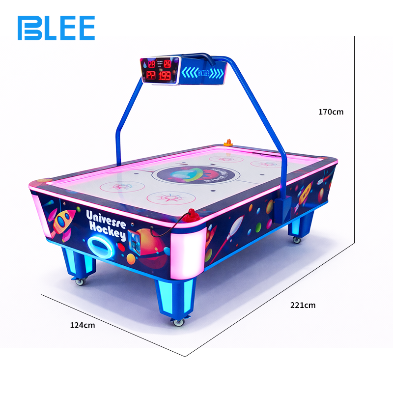 Two players engaged in intense competitive match, striking the puck with precision mallets.