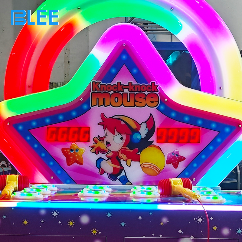 Close-up of illuminated mouse exit holes with vibrant multicolor LED lighting effects during active gameplay.