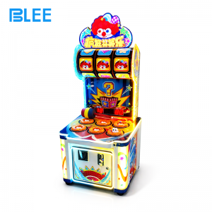 Child inserting coins into the easy-access payment slot to begin play.