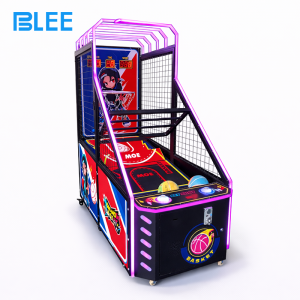 Young child joyfully shooting a soft basketball at the hoop while watching the digital score display.