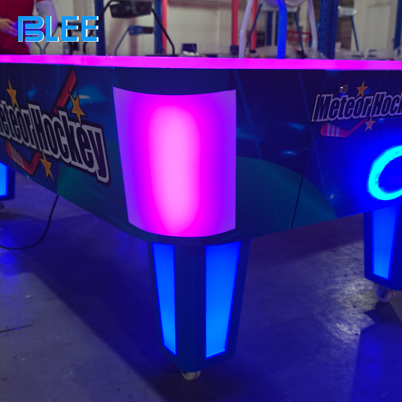 Close-up of dispensed tickets with printed point values ready for redemption counter.