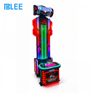 Crowd of spectators gathered around the machine, watching the LED tower during a powerful strike.