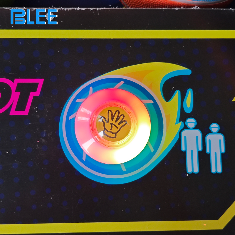 Close-up of the prize dispensing mechanism delivering a small toy to an excited young winner.