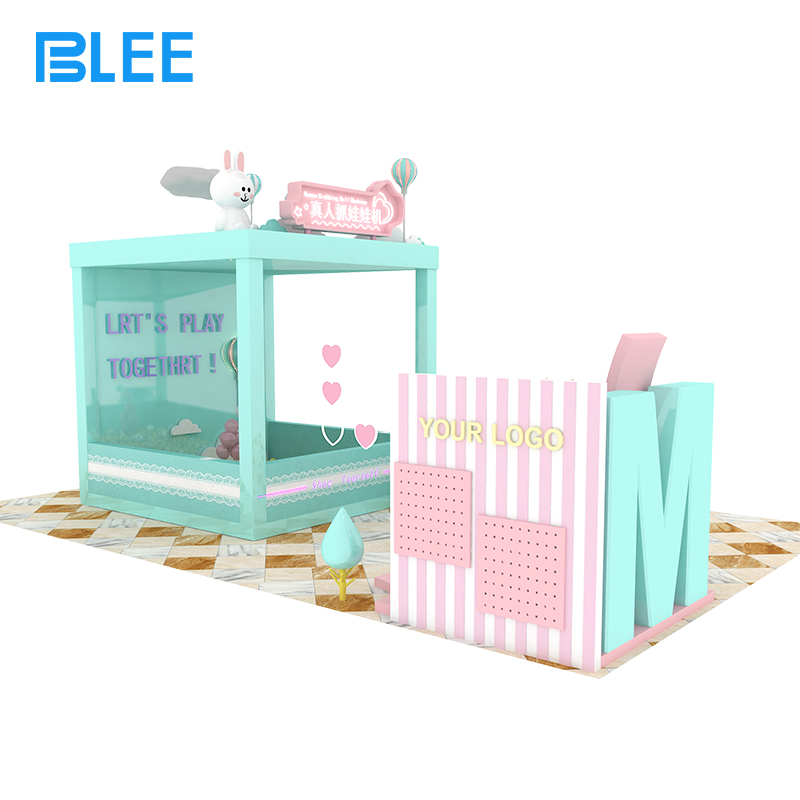 walk-in prize grabber Player strapped into the comfortable harness, being lifted above a colorful sea of plush toys and gifts.