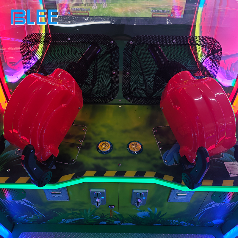 Full front view showcasing moving dinosaur targets, soft ball shooter mechanism, and prehistoric-themed marquee with glowing eyes.