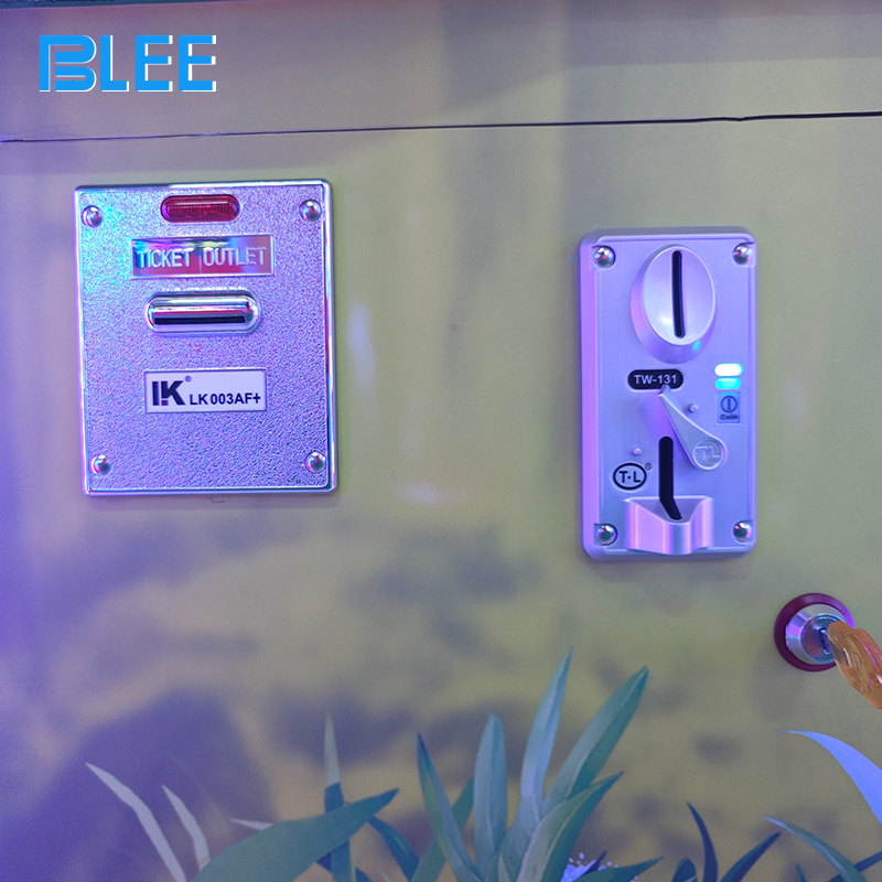 Close-up of the vandal-resistant ball shooter mechanism with easy-loading chamber and responsive firing button.