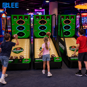 Multiple football throwing arcade machines installed in a mobile game trailer